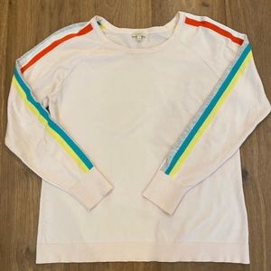 Light weight pink sweater with colorful stripes on sleeves